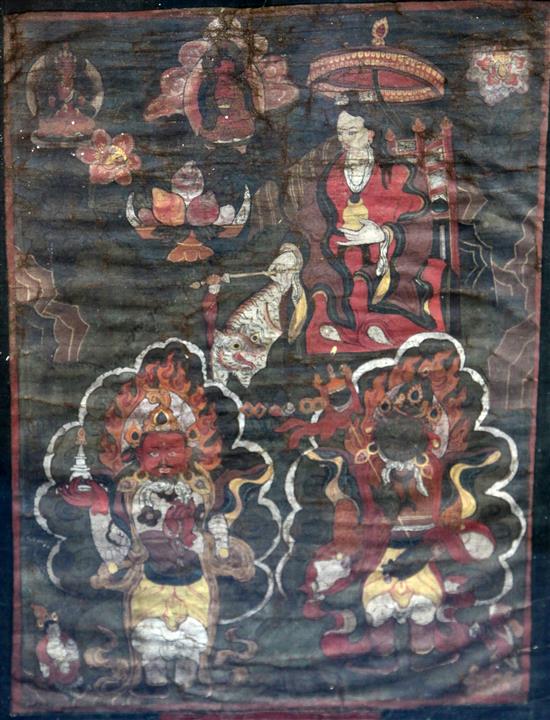 A pair of Tibetan oil on canvas thangkas, 18th/19th century, images 54cm x 40cm excl. silk borders